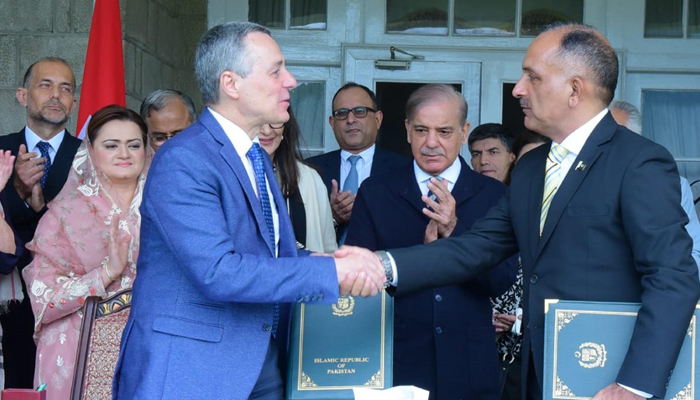 Prime Minister Shehbaz Sharif witnesses signing of the MoU between Swiss foreign minister and National Disaster Management Authority (NDMA) chairman on Saturday, July 8. — PID