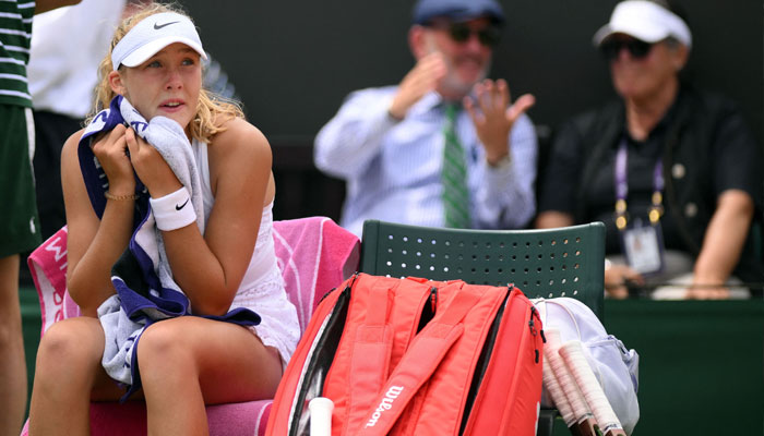 Russia´s Mirra Andreeva reacts during a break in play against US player Madison Keys during their women´s singles tennis match on the eighth day of the 2023 Wimbledon Championships at The All England Tennis Club in Wimbledon, southwest London, on July 10, 2023. —AFP