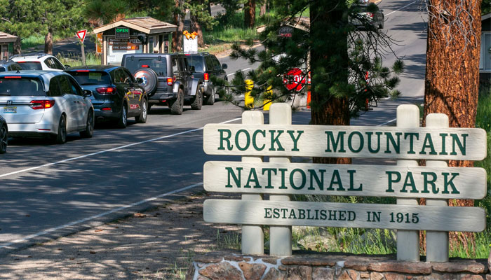 Visitors line up at Rocky Mountain National Park’s Fall River Entrance Station, near Estes Park, on July 21, 2021. — CPR News/File