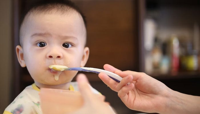 This representational picture shows a baby being fed by their parent. — Unsplash/File