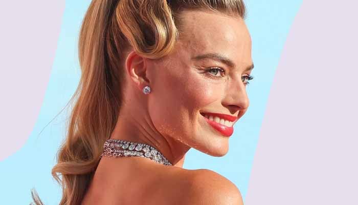 After spending the day posing for photos, Margot Robbie still managed to glow at the end of the night