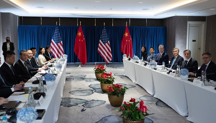 US Secretary of State Antony Blinken sits at a table with advisors (right) across from Director of the CCP Central Foreign Affairs Office Wang Yi and his advisors on July 13, 2023. — Twitter/@SecBlinken