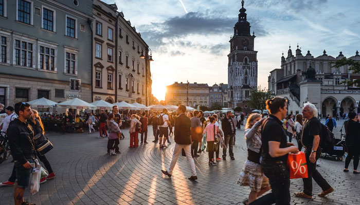 Tourists are seen on Main Market Square in Krakow, Poland. Unsplash