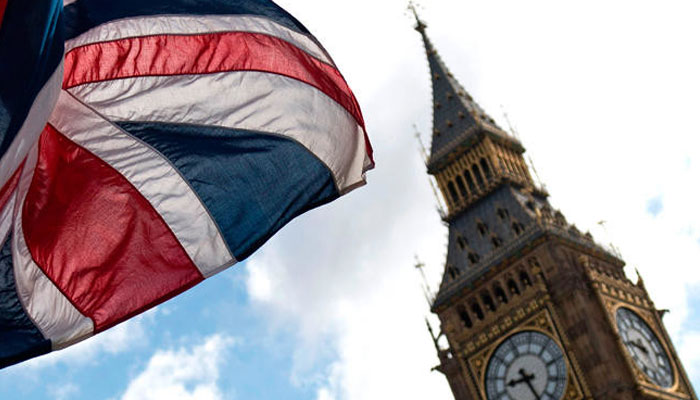 A Union flag flies from a flagpole opposite the Elizabeth Tower, commonly reffered to as Big Ben, at the Houses of Parliament in central London. — AFP/File
