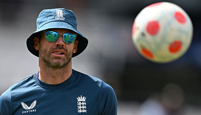 England´s James Anderson plays football with teammates as they warm ahead of play on day one of the third Ashes cricket Test match between England and Australia at Headingley cricket ground in Leeds, northern England on July 6, 2023.—AFP