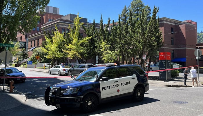 This picture shows a Portland Police vehicle outside the Legacy Good Samaritan Medical Center in Portland, while an active shooter was inside. — Twitter/@jadenschaul