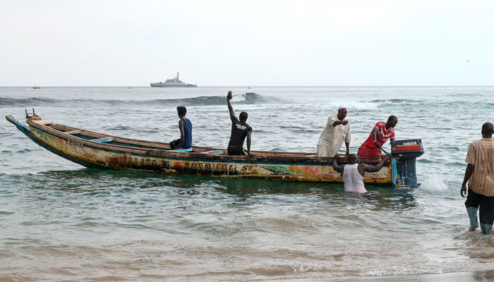 Local fishermen prepare a pirogue for a rescue operation in Ouakam, in Dakar on July 24, 2023, after a boat capsized off the coast of Dakar. — AFP