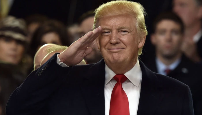 Donald Trump salutes during the presidential inaugural parade in Washington on Jan. 20, 2017. AFP/File