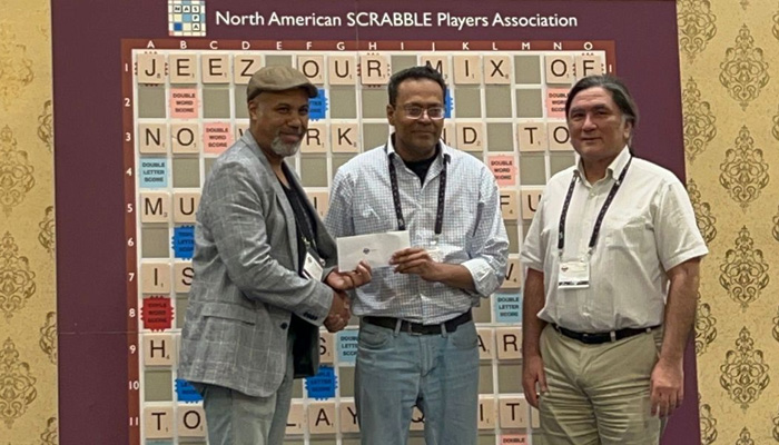 Pakistans Muhammad Inayatullah is awarded the winning prize for the Late Bird tournament at the World Scrabble Championship. — Photo by author