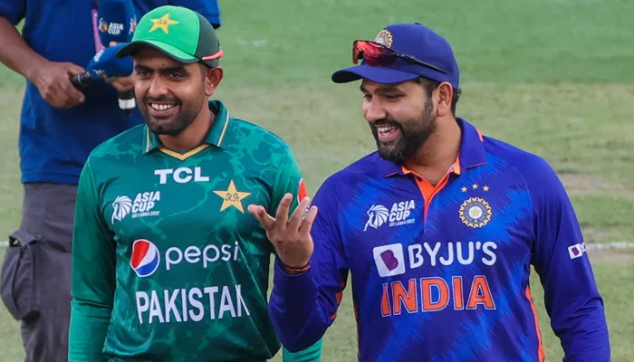 Pakistans skipper Babar Azam and Indian captain Rohit Sharma are seen smiling together during Asia Cup 2022. — AFP/File