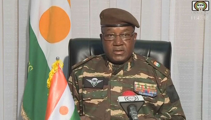 This video grab image obtained on July 28, 2023 shows General Abdourahamane Tchiani, Nigers new leader, reading a statement as President of the National Council for the Safeguarding of the Fatherland, after the ousting of President Mohamed Bazoum. — AFP