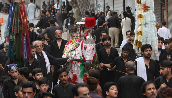 Muslims participate in Ashura procession,tenth day of Muharram-ul-Haram, at the Qissa Khwani Bazaar in Peshawar on July 28, 2023. — Online