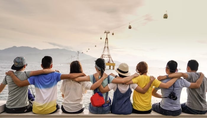 This representational picture shows a group of friends enjoying the view of a river. — Unsplash/File