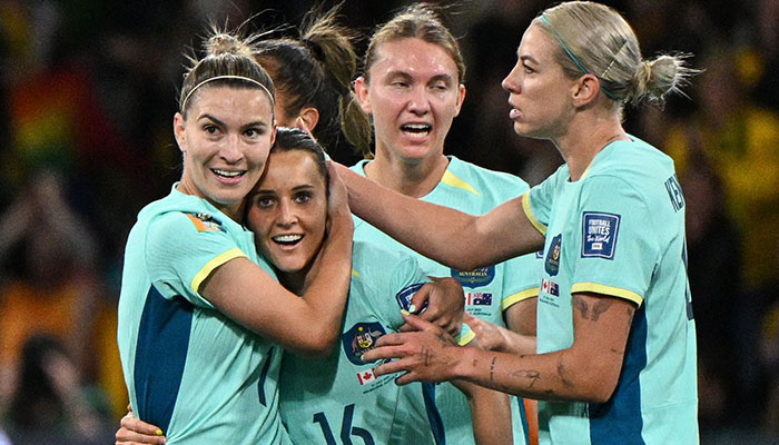 Australia´s forward Hayley Raso (2L) celebrates scoring her team´s first goal during the Australia and New Zealand 2023 Women´s World Cup Group B football match between Canada and Australia at Melbourne Rectangular Stadium, also known as AAMI Park, in Melbourne on July 31, 2023.—AFP