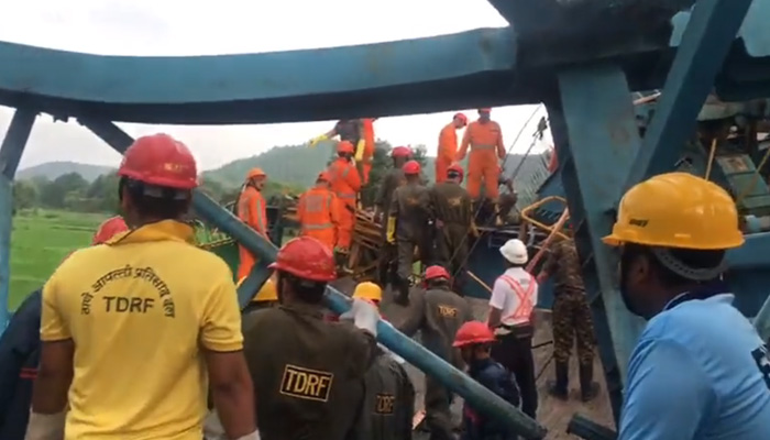 Rescue workers recover the dead and injured buried under the collapsed crane in Mumbai on August 1, 2023, in this still taken from a video. — Twitter/@IndianExpress