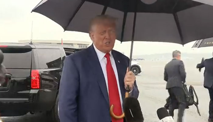 Former US president Donald Trump speaks to the media while standing on the airport tarmac before leaving Washington. Twitter video.