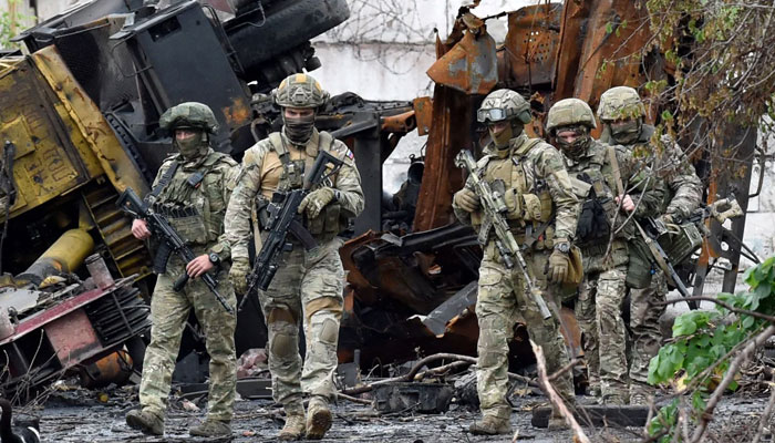 Russian servicemen patrol the destroyed part of the Ilyich Iron and Steel Works in Ukraines port city of Mariupol on May 18, 2022. — AFP/File