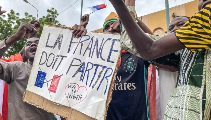 Protesters hold an anti-France placard during a demonstration in Niamey, Niger, August 3, 2023. — AFP