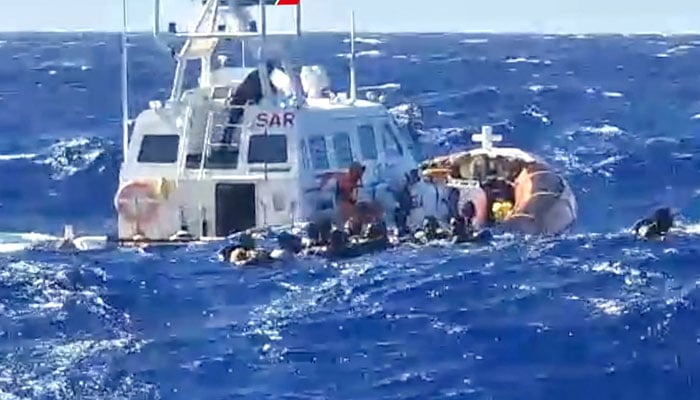 This picture shows a rescue operation that took place south of Lampedusa, consisting in rescuing 57 migrants, also recovering the lifeless bodies of a woman and a minor on board. — AFP