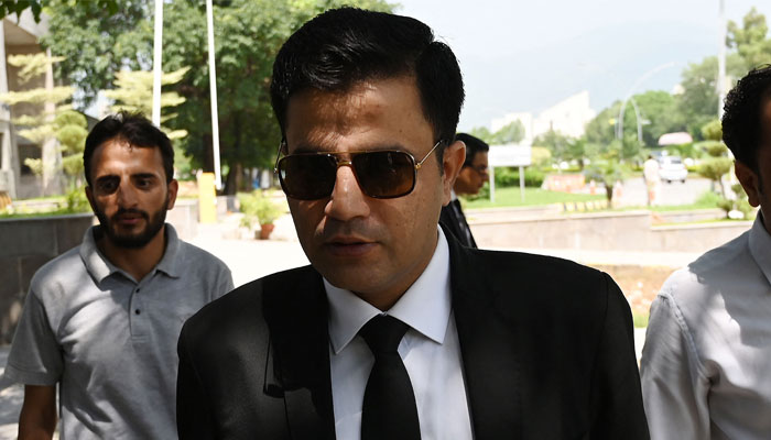 Naeem Haider Panjutha (centre), lawyer and legal team member of Imran Khan, arrives at the high court to file a petition against the PTI chiefs conviction in Islamabad on August 8, 2023. — AFP