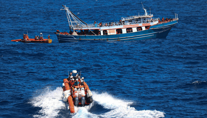 Rescue officials launched speed boats to assess the feasibility of the rescue and distributed life jackets to the migrants on a boat off from Malta. — AFP