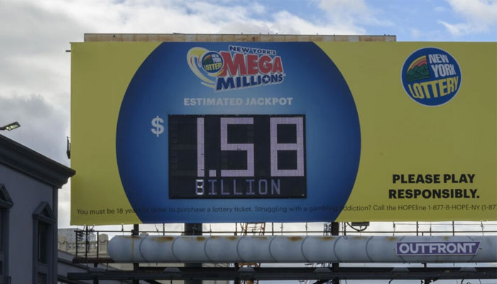 New Yorks Mega Millions lottery ad displayed on a billboard along with its estimated value on 9 August 2023. — AFP