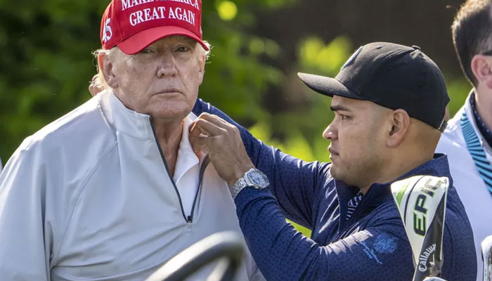 Walt Nauta, Donald Trump’s personal aide, helps him with a shirt during LIV Golf’s pro-am tournament at Trump National Golf Club in Sterling, Va. on May 25, 2023. Nauta, the only other person indicted along with... seattletimes.com