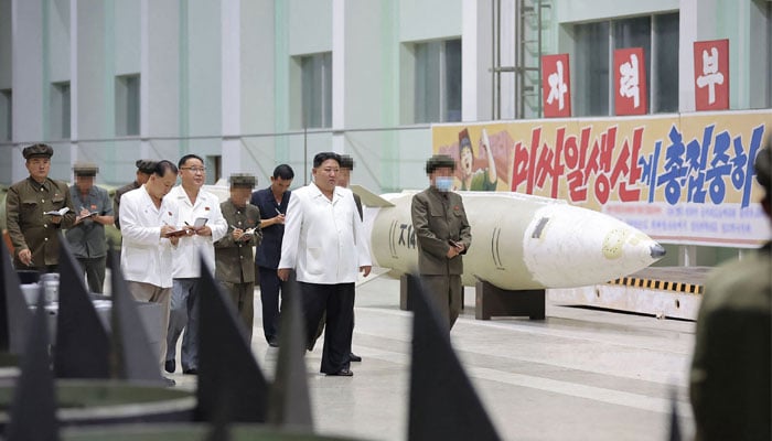 This photo released from North Koreas official Korean Central News Agency (KCNA) on August 14, 2023 shows North Koreas leader Kim Jong Un (C) inspecting an important munitions factory at an undisclosed location in North Korea. — AFP