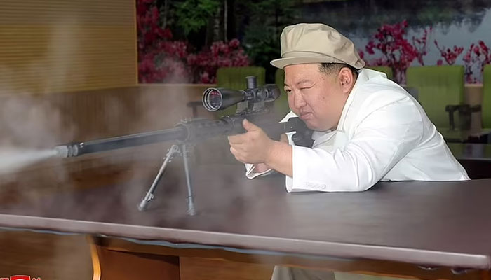 This picture taken during the period from August 3 to August 5, 2023 and released from North Koreas official Korean Central News Agency (KCNA) on August 6, 2023 shows North Korean leader Kim Jong Un inspecting a new series of firearm. AFP