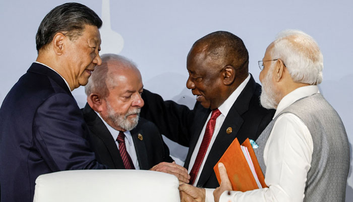 (From L to R) President of China Xi Jinping, President of Brazil Luiz Inacio Lula da Silva, South African President Cyril Ramaphosa and Prime Minister of India Narendra Modi gesture during the 2023 BRICS Summit at the Sandton Convention Centre in Johannesburg on August 24, 2023.—AFP