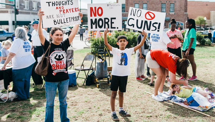 Parents and kids protest against gun violence in the US. — Unsplash/File