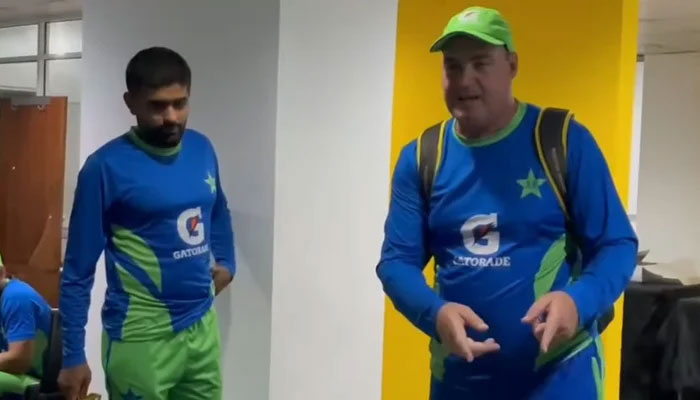 Mickey Arthur (R) speaks to the Pakistan team in the dressing room after the third ODI against Afghanistan. — PCB