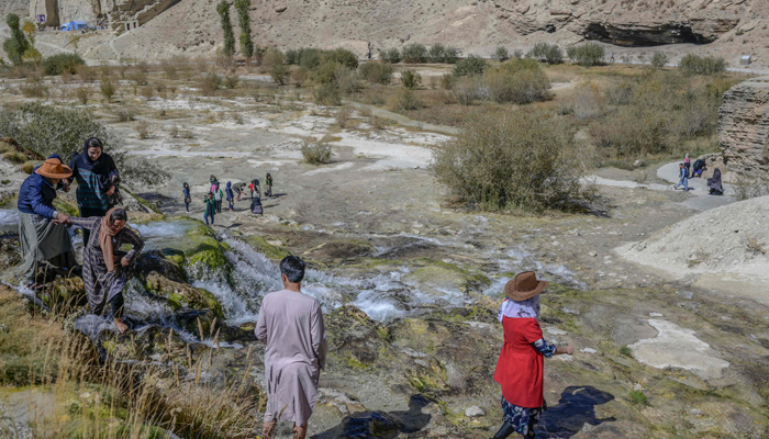 People enjoy their day at the Band e-Amir Lake in the Bamiyan Province on October 4, 2021. — AF