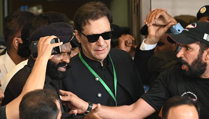 Pakistans former Prime Minister Imran Khan (C) leaves after appearing in the Supreme Court in Islamabad on July 24, 2023. — AFP