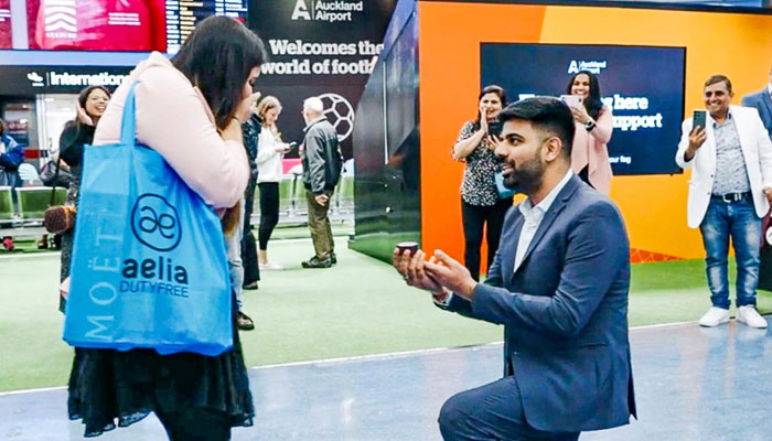 Man plans a filmy airport proposal to surprise girlfriend who flew back to her home. Courtesy Auckland Airport