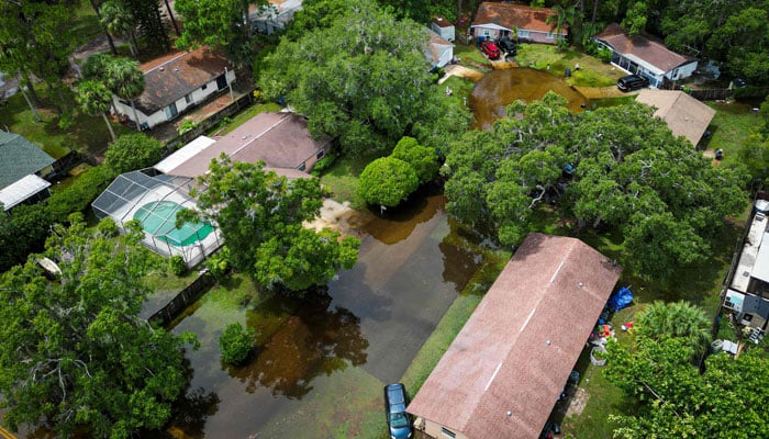 An aerial view shows a flooded community in New Port Richey, Florida, on August 30, 2023, after Hurricane Idalia made landfall earlier in the day. Idalia slammed into northwest Florida as an extremely dangerous Category 3 storm early Wednesday, buffeting coastal communities with cascades of water as officials warned of catastrophic flooding in parts of the southern US state. AFP