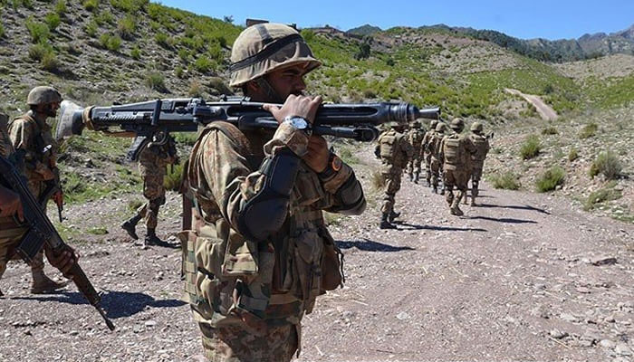 A group of Pakistan Army soldiers can be seen patrolling in this undated photo. — ISPR