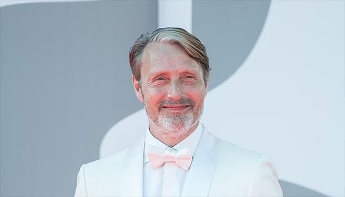 Mads Mikkelsens arrival at Venice Film Festival amid SAG-AFTRA strikes.