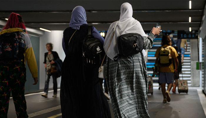 Muslim women wearing abaya in France. — AFP