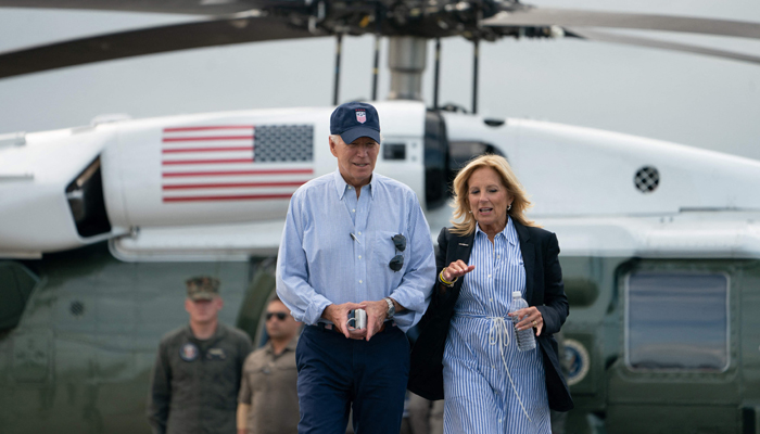 US President Joe Biden and First Lady Jill Biden walk towards Air Force One before departing from Gainesville, Florida, on September 2, 2023. — AFP