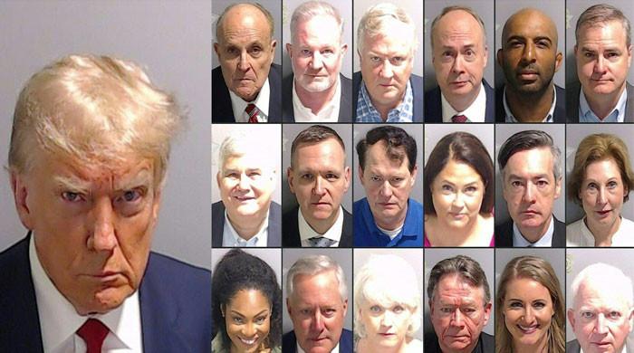 Donald Trump, 18 other defendants enter not-guilty plea in Georgia ...