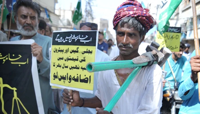 A labourer participates in a protest rally against the surge in electricity and fuel prices in Hyderabad on September 2, 2022. — Online