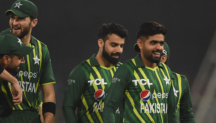 Pakistans captain Babar Azam (R) and teammates celebrate after winning the first Twenty20 cricket match between Pakistan and New Zealand at the Gaddafi Cricket Stadium in Lahore on April 15, 2023. — AFP