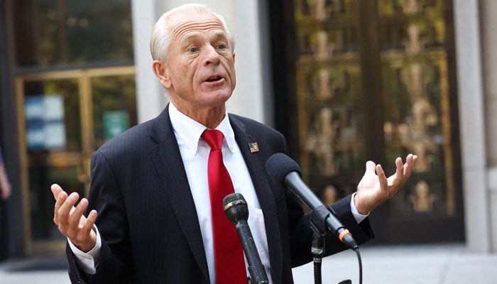 Peter Navarro, an advisor to former US President Donald Trump, speaks to reporters as he arrives at the E Barrett Prettyman Courthouse on September 07, 2023, in Washington, DC. — AFP