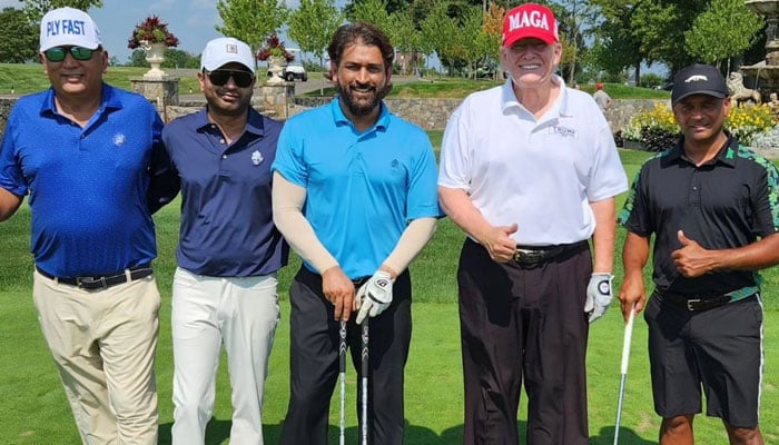 MS Dhoni (Centre) poses with Donald Trump and other friends. — Instagram/@hitesh412740