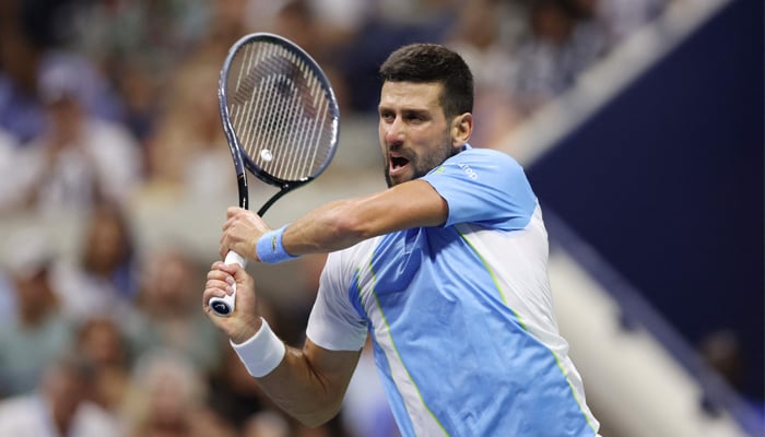 Novak Djokovic of Serbia returns a shot against Ben Shelton of the US during their Singles Semifinal match on Day Twelve of the 2023 US Open at the USTA Billie Jean King National Tennis Center on September 08, 2023. — AFP