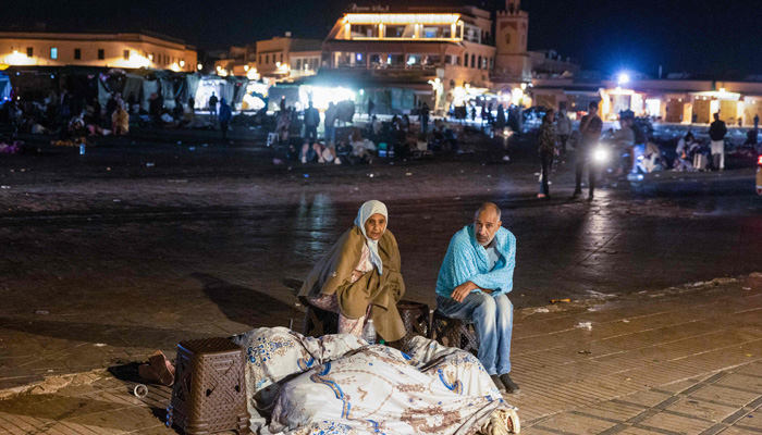 Residents take shelter ouside at a square following an earthquake in Marrakesh on September 9, 2023. — AFP