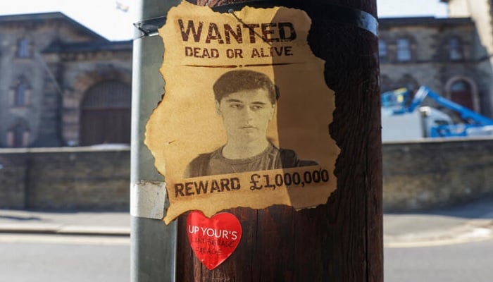 A wanted sign featuring an image of Daniel Abed Khalife, a former soldier who is suspected of terrorism offences, is displayed, near Wandsworth prison which he escaped from, in London, Britain, September 7, 2023.— Twitter/File