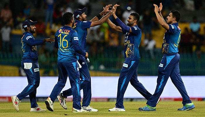 Sri Lankas captain Dasun Shanaka (2-R) celebrates with teammates after taking the wicket of Bangladesh´s Mushfiqur Rahim (not pictured) during the Asia Cup 2023 super four one-day international (ODI) cricket match between Sri Lanka and Bangladesh at the R. Premadasa Stadium in Colombo, on September 9, 2023. — AFP