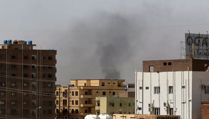 Smoke rises above buildings in Khartoum on April 15, 2023, amid reported clashes in the city.—AFP